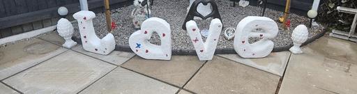 — love concrete letters and acorns 