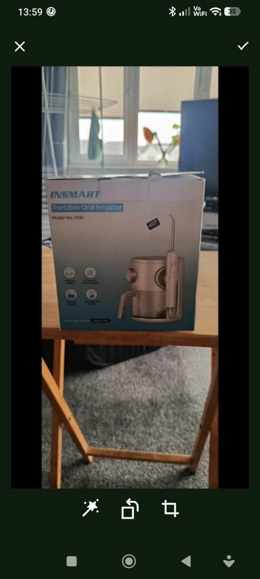  — portable oral irrigator