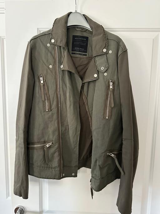  — olive‑green AllSaints jacket