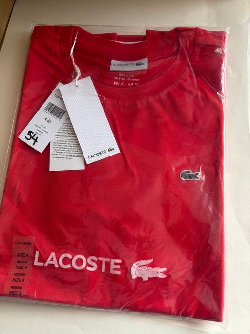  — Lacoste