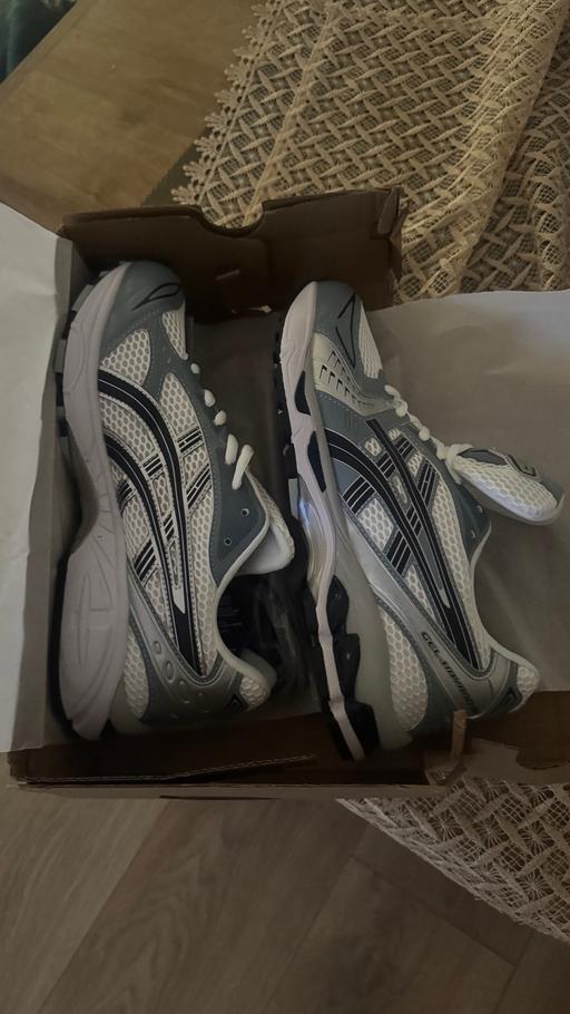  — ASICS