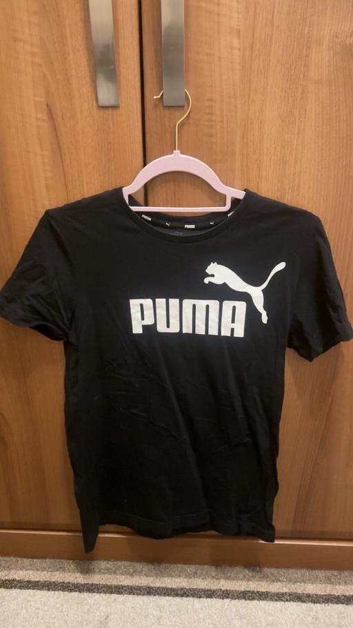  — Women’s black puma top