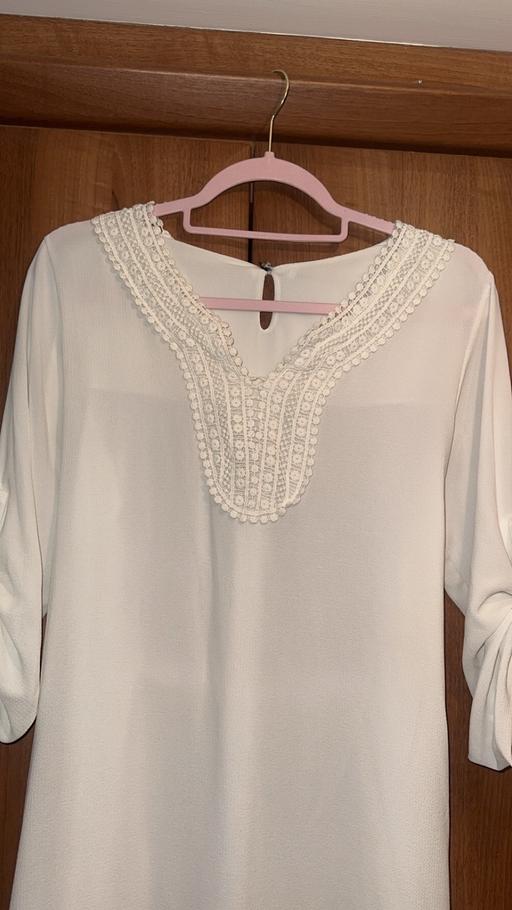  — Women’s stylish white holiday dress