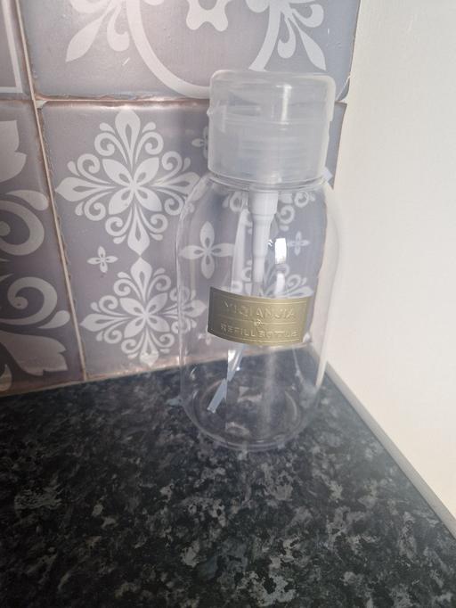  — brand new refillable bottle