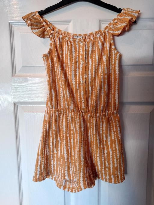  — Girls orange/white playsuit size 10-11 years