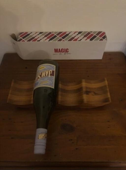  — " Magic in a Box" wine stand