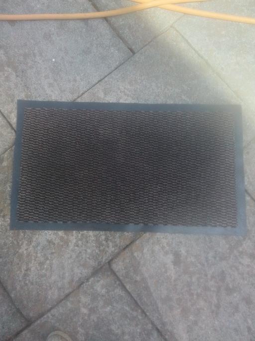  — DOOR MAT
