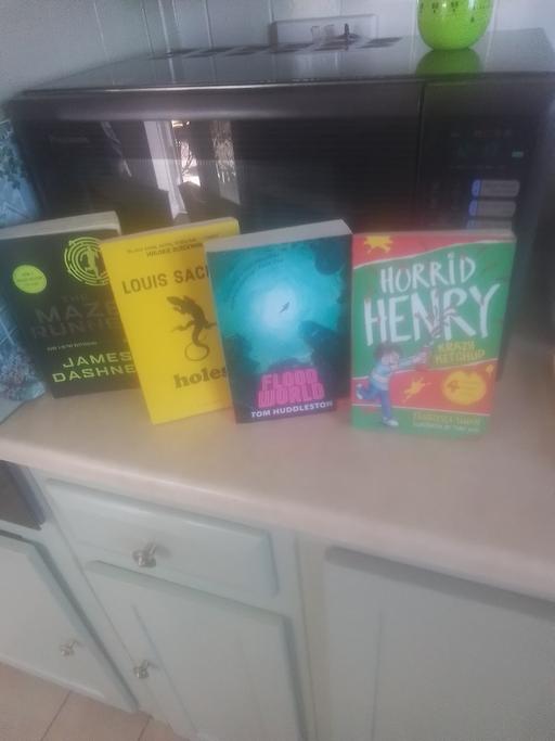  — FOUR BOOKS