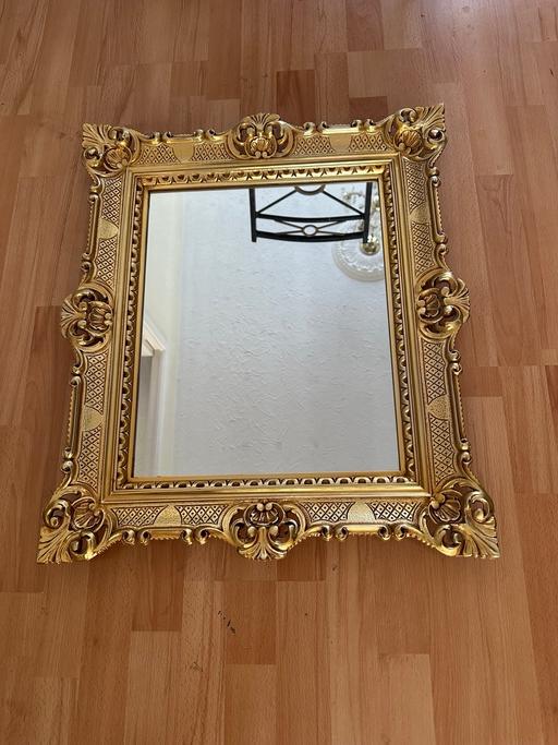  — Antique gold mirror