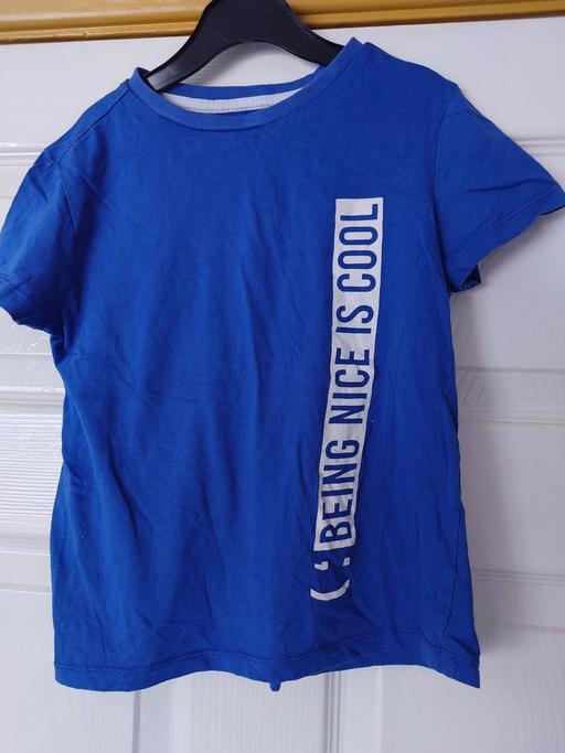  — Boys blue top size 6-7 years