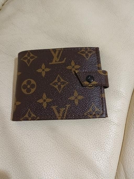  — BRAND NEW WALLET .