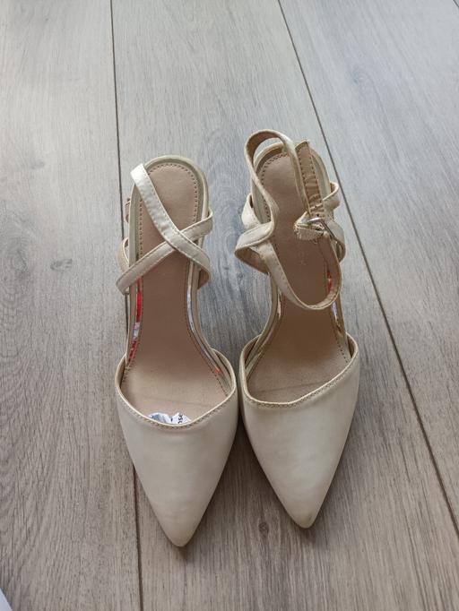  — HIGH HEELS