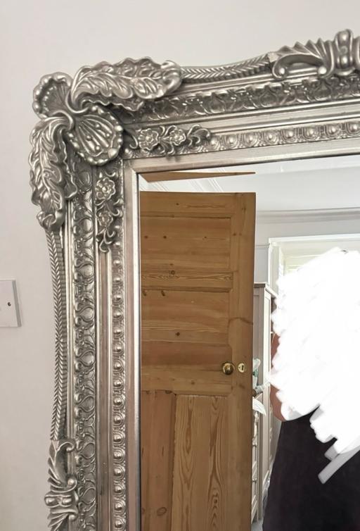  — Large ornate silver mirror