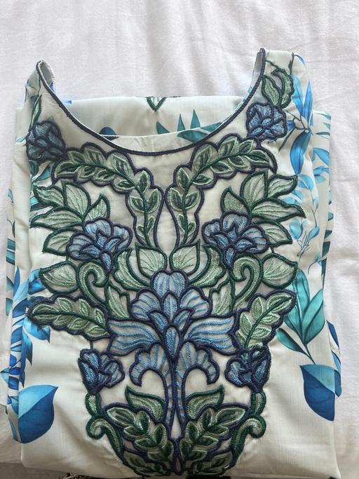  — Embroided suit