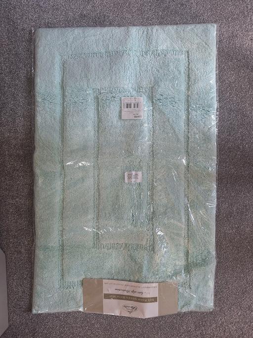  — New Bath Mat