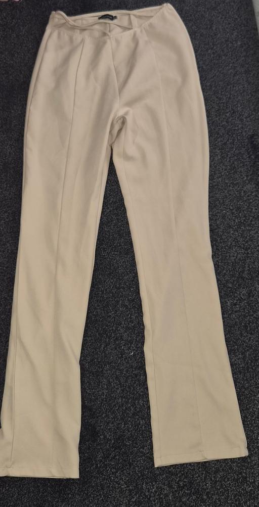  — Beige trousers