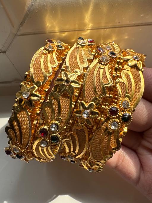  — GOLD BANGLES