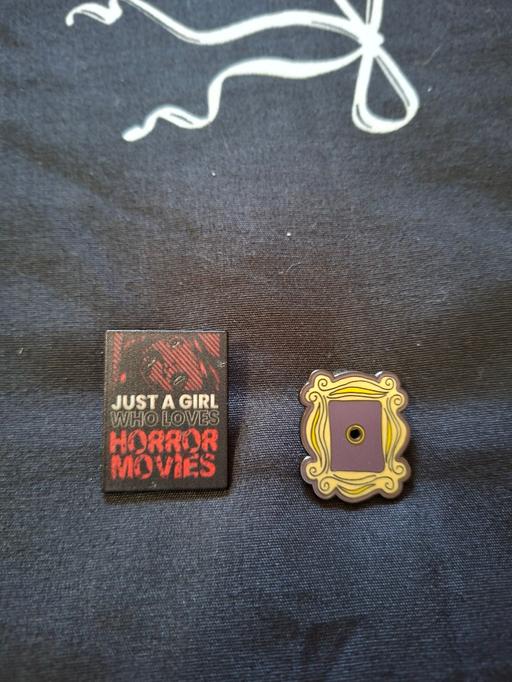  — 2 pin badges