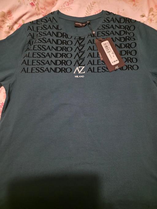  — Teal tshirt in XL. Embossed detail.