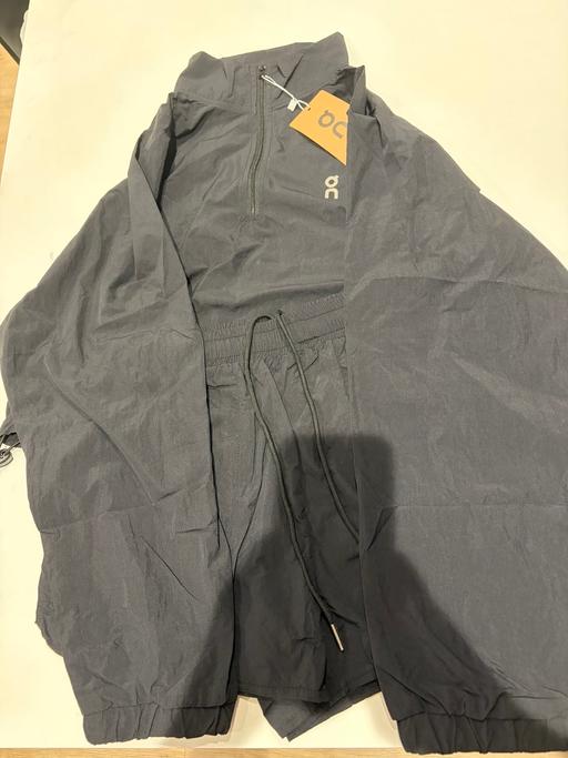  — Woman’s on cloud half zip jacket with shorts