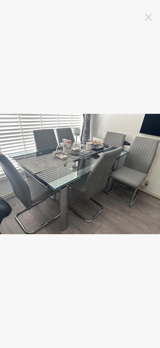  — Dining table with 6 faux leather grey chairs