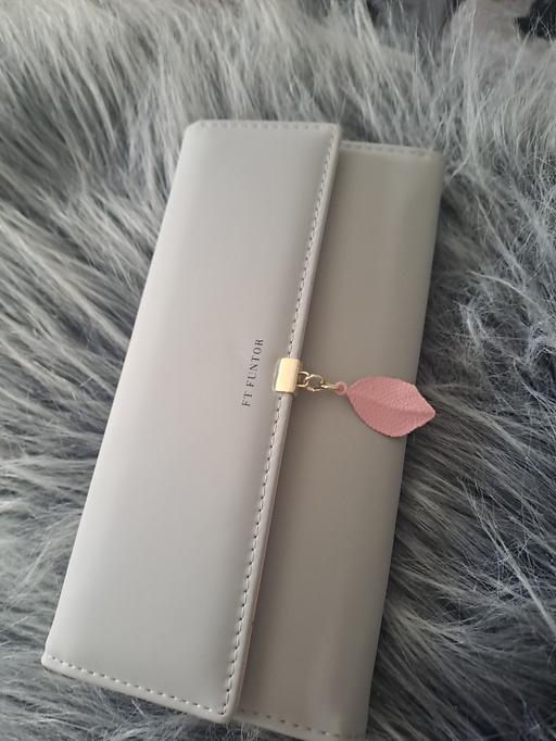  — long new purse