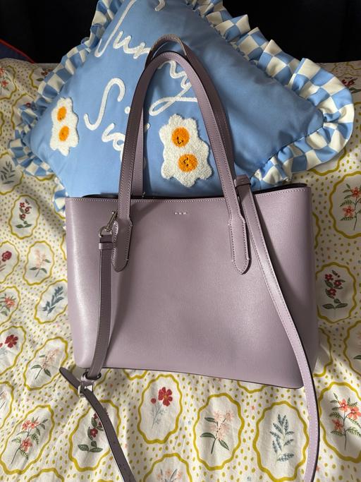  — Purple coach bag