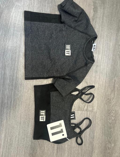  — 2 gym tops