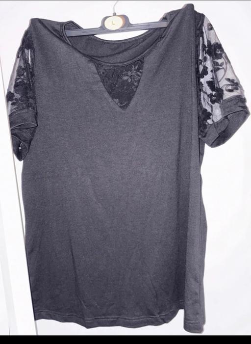  — New ladies Top with mesh sleeves