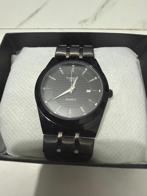  — Tissot quartz watch- black and as good as new
