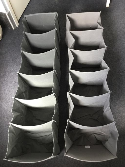  — 2 hanging cloth storage compartments.