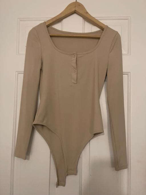  — Beige bodysuit