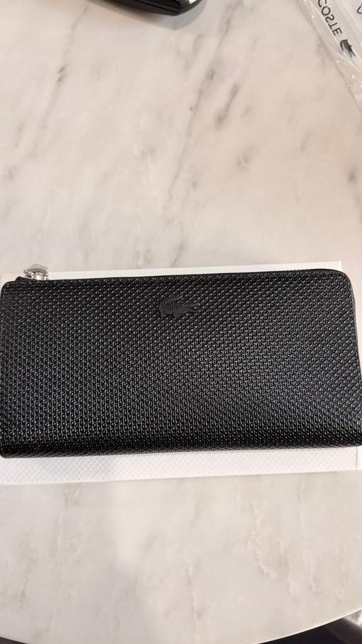  — Lacoste black leather Zip Around wallet