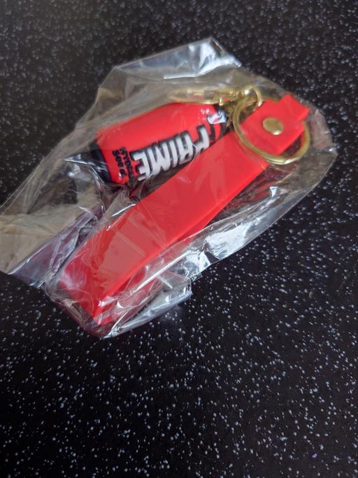  — Red prime can keychain
