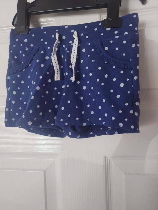  — Girls navy spotty shorts size 3-4 years