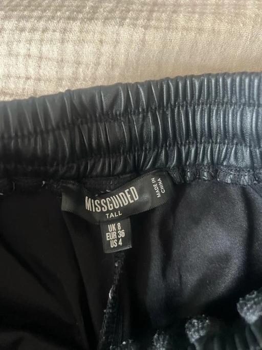  — Tall black faux leather joggers
