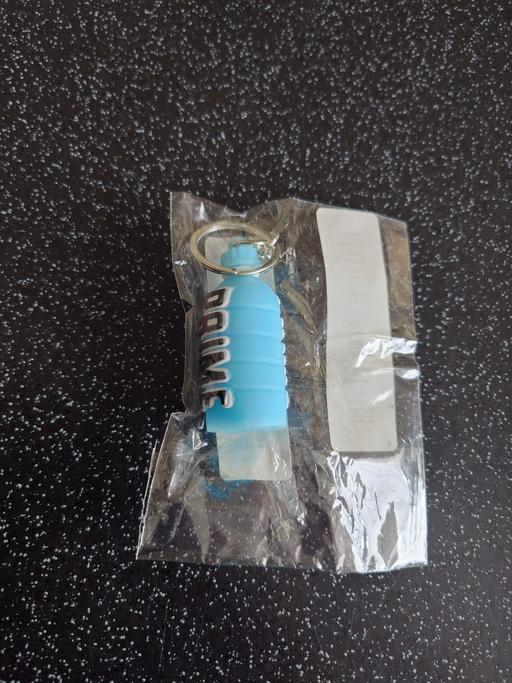  — Blue prime bottle keychain