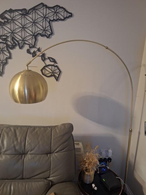 — Gold curved floor lamp