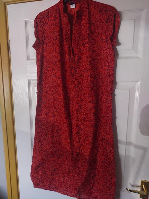  — Women's orange patterned dress size S/P