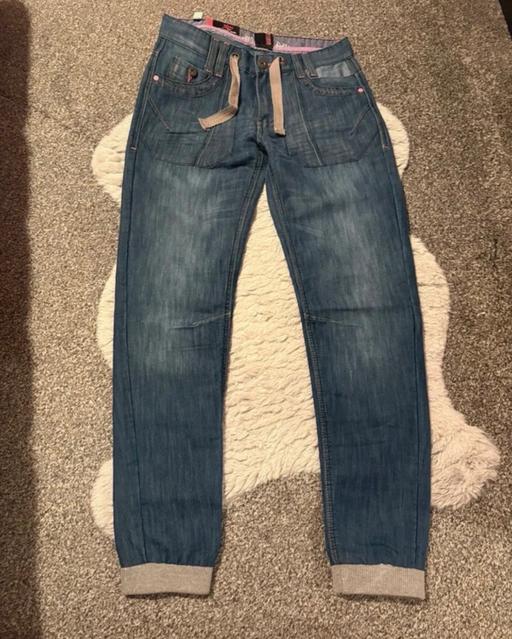  — Voodoo dolls women’s  jeans size 8