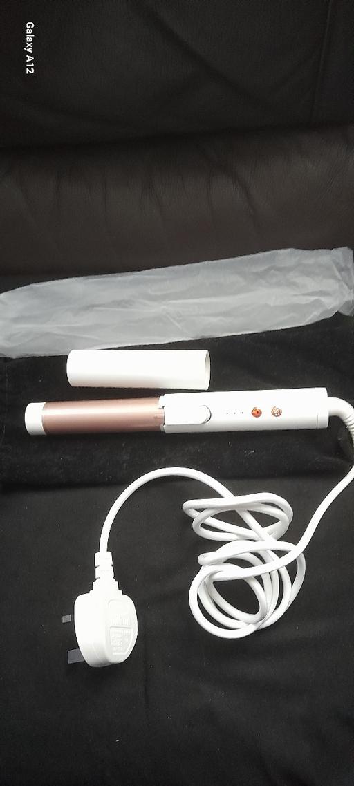  — curling tongs