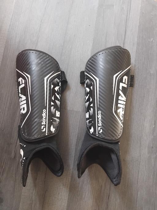  — Shinpads.