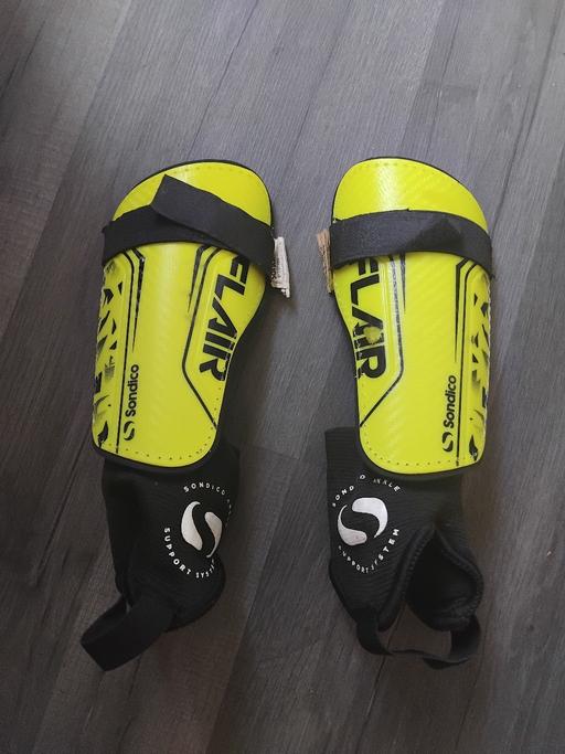  — Shinpads.