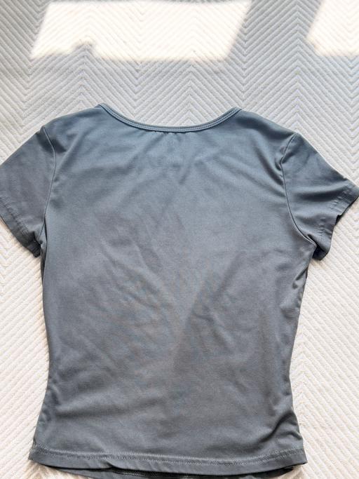  — grey top