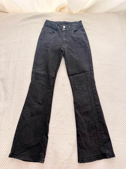  — black low-rise flared jeans