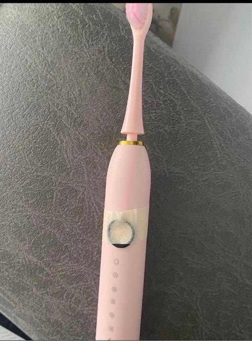  — Pink electric toothbrush