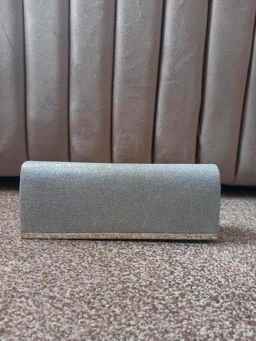  — clutch bag