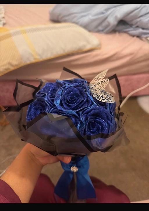  — Blue handmade glitter roses bouquet with But