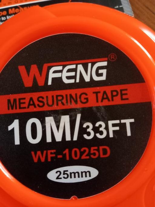  — WFENG measuring tape, model WF‑1025D, housed