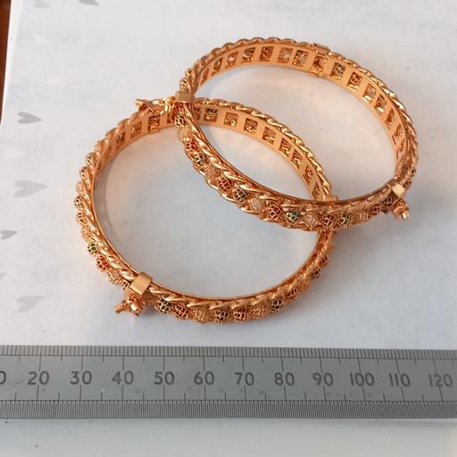  — 2 beautiful ornate gold plated Asian bangles